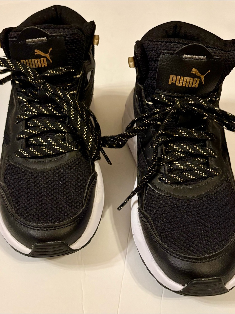 Puma Black and Gold women’s size 6.5
6 1/2 Sneakers X-Ray Speed Mid-Top